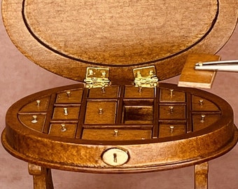 Miniature sewing table with many compartments