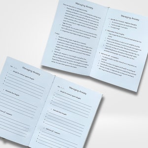 May include: A blue and white journal with the title "Managing Anxiety" on the cover. The journal is open to a page with instructions on how to manage anxiety. The instructions include identifying negative thoughts, rationalizing those thoughts, and adding self-compassion.