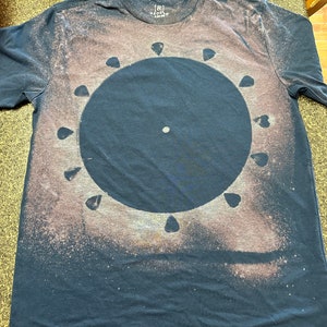 Bleached vinyl guitar pick T