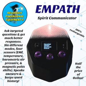 May include: A black Empath Spirit Communicator device with a screen displaying text. The device has purple buttons and a pink top. Text on the device includes "November Wanted Beneficent Enticed" and "100% rechargeable."