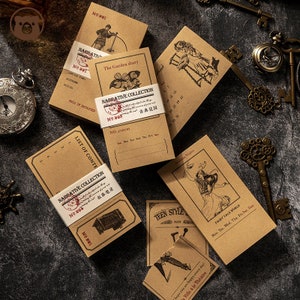 May include: A set of five brown paper notebooks with vintage illustrations and text. The notebooks have a rustic aesthetic and feature titles like "The Garden Diary", "Arabian Nights", "Fairy Tale World", and "Teen Style".