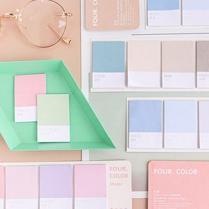 May include: A set of pastel coloured sticky notes with different colour combinations. The notes are labelled with names like "Peach", "Mint Icing", "Hazy", "Livid", "Oak", "Dese", "Apricot", "Sorbet", "Hirislais", "Violet", "Kapora", and "Four. Color Sticker".