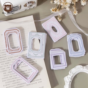 May include: A set of decorative frame stickers in various colours and patterns. The stickers are designed to be used for scrapbooking, journaling, and other craft projects.
