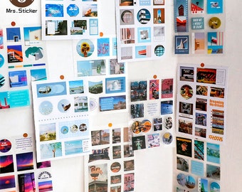 May include: A collection of colourful stickers featuring various designs, including cityscapes, buildings, and abstract patterns. The stickers are arranged on a white wall, creating a vibrant and eclectic display.