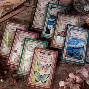 May include: A selection of vintage journal cards, each with a rectangular frame and the words "Time Excerpt". The cards display diverse illustrations, such as a fern, map, butterfly, and a starry night painting. They are arranged on a wooden surface, creating a nostalgic aesthetic.