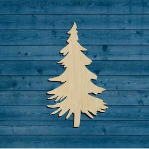 May include: A wooden cutout of a stylized pine tree, painted in a light brown color, against a blue woodgrain background.