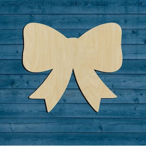 May include: A wooden bow shape cutout, perfect for crafting and decorating. The bow is made of unfinished wood and is ready to be painted or stained.