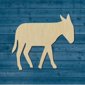 May include: A wooden cutout of a donkey, a farm animal, in a walking pose. The cutout is light brown and is against a blue wood background.
