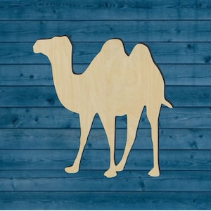 May include: A wooden cutout of a camel, a popular animal in desert regions. The camel is facing right and has two humps. The cutout is unpainted and has a natural wood color.