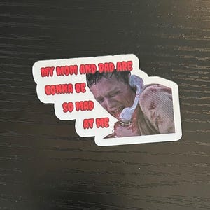 May include: A sticker with the text "MY MOM AND DAD ARE GONNA BE SO MAD AT ME" in red letters on a white background. The sticker features a distressed image of a person.
