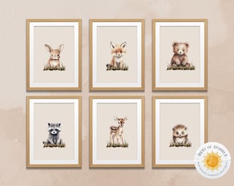 May include: Set of six framed prints featuring watercolour illustrations of woodland animals. Each print depicts a different animal, including a rabbit, fox, bear, raccoon, deer, and hedgehog. The prints are all in a neutral beige colour scheme and have a simple, minimalist design.