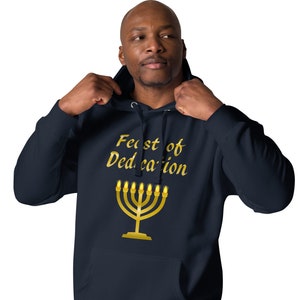 May include: A navy blue hoodie with a gold menorah and the text "Feast of Dedication" printed on the front.