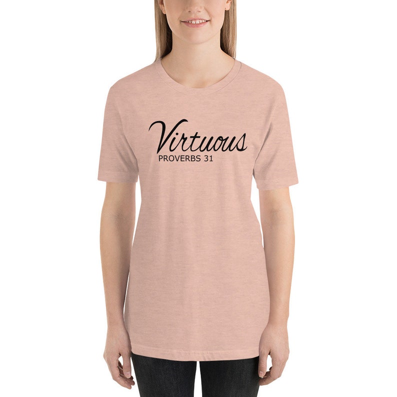 May include: A light pink t-shirt with black text that reads "Virtuous Proverbs 31".