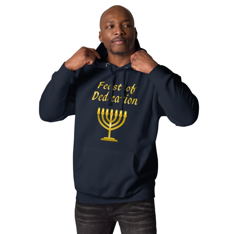 May include: A navy blue hoodie with a gold menorah and the text "Feast of Dedication" printed on the front.