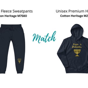May include: A matching set of navy blue fleece sweatpants and a hoodie. The sweatpants have a gold menorah and the text "Feast of Dedication" on the left leg. The hoodie has a gold menorah and the text "Feast of Dedication" on the front.