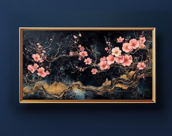 May include: A framed painting featuring a dark blue background with gold accents. Pink cherry blossoms adorn the branches, creating a contrast against the dark backdrop. The artwork is encased in a gold frame.