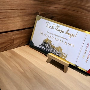 gold foil hotel reservation voucher for a weekend away