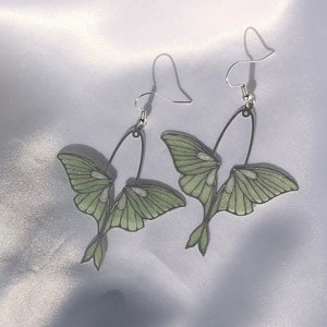 Pastel green moth earrings