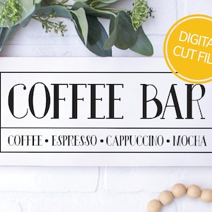 May include: White sign with black text that reads "Coffee Bar" and "Coffee, Espresso, Cappuccino, Mocha".