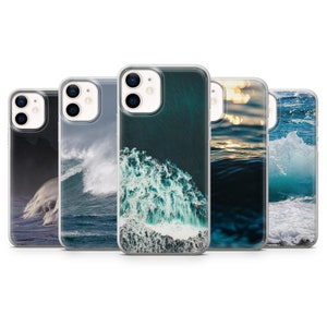 May include: Set of five clear phone cases with different ocean-themed images. The cases feature a variety of blue and green hues, with waves crashing and a sunset over the water.