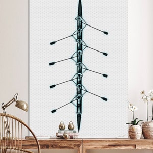 May include: A black and white illustration of a rowing team in a boat. The boat is viewed from above, with the rowers facing the viewer. The rowers are all in a line, with their oars extended out to the sides. The boat is on a white background with a subtle pattern.