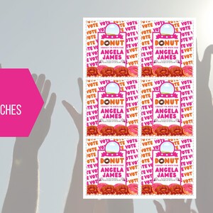May include: Six 8.5 by 11 inch printable voting campaign signs featuring a pink donut with the text "Donut forget to vote for Angela James". The signs are surrounded by a repeating pattern of the word "Vote" in orange.