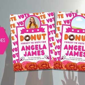 May include: Two pink and white door hangers with the words "Donut Forget to Vote for Angela James" and a donut graphic. The door hangers are 11 inches by 14 inches.