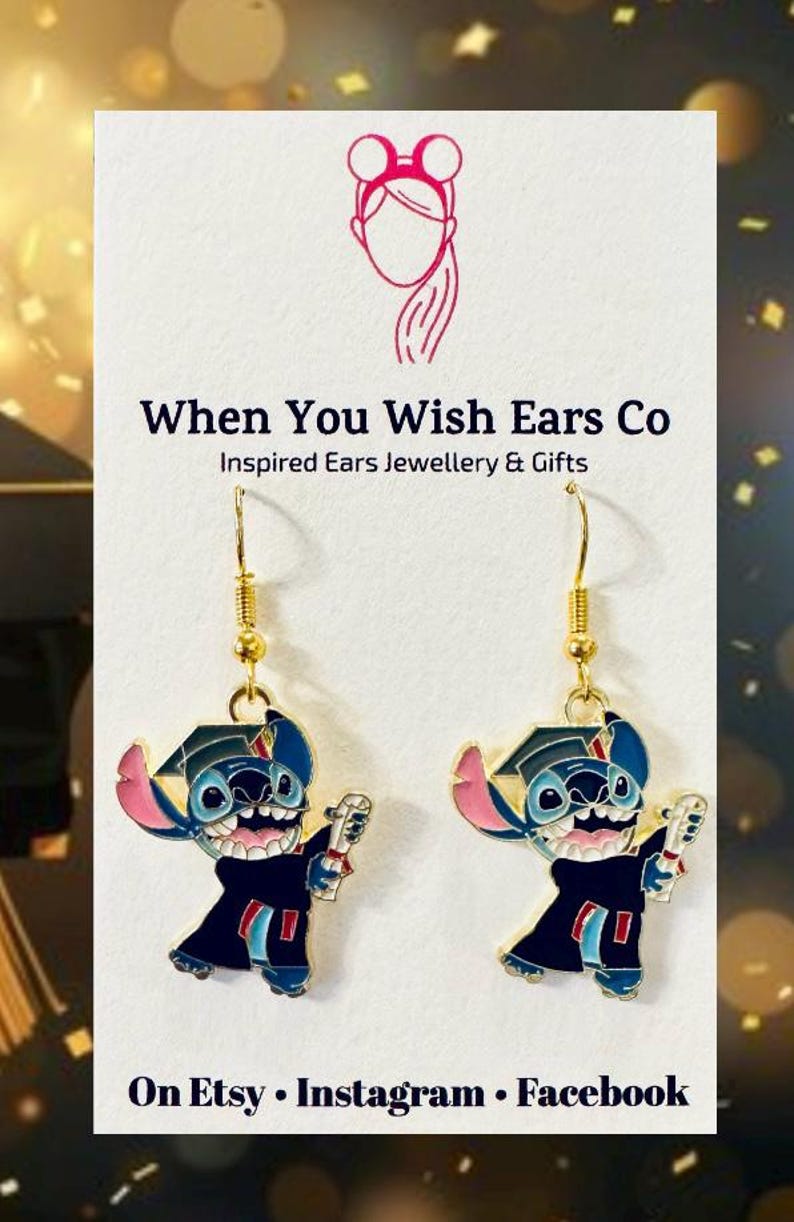 May include: A pair of gold dangle earrings featuring a blue Stitch character wearing a graduation cap and gown, holding a diploma. The earrings are from When You Wish Ears Co, Inspired Ears Jewellery & Gifts. The text "On Etsy, Instagram, Facebook" is also visible.