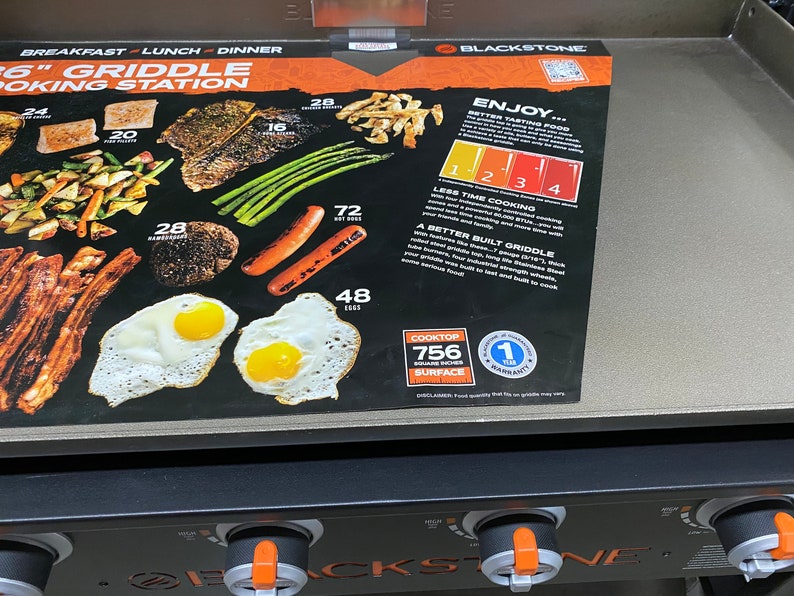 May include: Blackstone 36-inch griddle cooking station with a black and orange control panel. The griddle has a 756 square inch cooking surface and comes with a 1-year warranty. The image shows a variety of foods that can be cooked on the griddle, including bacon, eggs, hot dogs, asparagus, and steak.