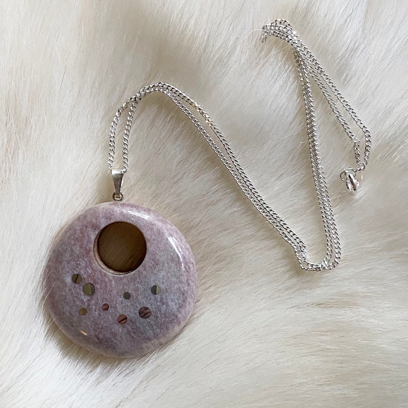 Pendant handcrafted from reindeer antler and wood.