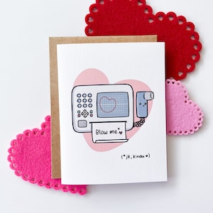 May include: A Valentine's Day card featuring a pink and white illustration of a heart monitor with the text "Blow me. (jk, kinda)"