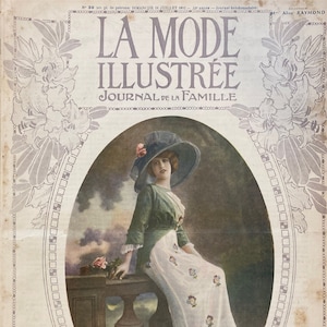 May include: A vintage magazine cover featuring a woman in a white dress and a green jacket, sitting on a stone railing. The magazine is called "La Mode Illustrée Journal de la Famille" and the cover is decorated with floral designs.