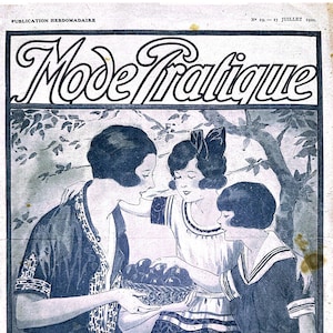 May include: A vintage magazine cover featuring a black and white illustration of three women in 1920s fashion. The women are sitting under a tree and holding a basket of fruit. The magazine title is "Mode Tralique" and the price is 50 cents.