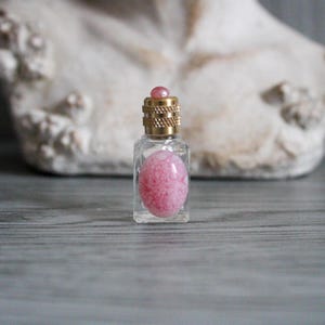 May include: A set of three ceramic nesting bowls. The largest bowl is light blue, the medium bowl is green, and the smallest is yellow. Each bowl has a smooth, glossy finish and a simple, modern design.