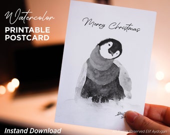 May include: A black and white watercolor illustration of a penguin wearing a scarf. The penguin is looking to the left and the text "Merry Christmas" is written above the penguin.