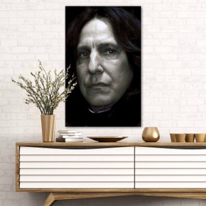 May include: A black and white portrait of a man with long dark hair and a serious expression. The man is wearing a dark shirt and his hair is parted on the side.