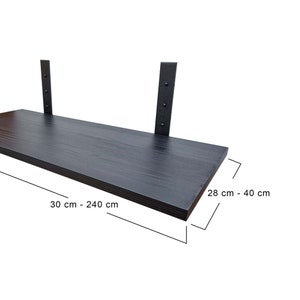 May include: Black floating shelf with metal brackets. The shelf is 30 to 240 cm long and 28 to 40 cm deep.