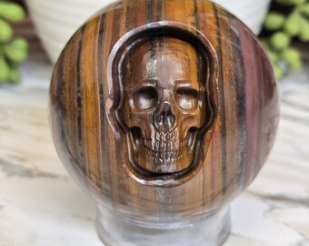 Tiger Iron Sphere with Skull carving 2.68in, 1lbs 3oz