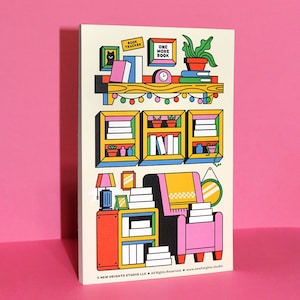 May include: A colorful illustration of a cozy reading nook with bookshelves, a pink armchair, and a lamp. The image includes the text "BOOK TRACKER" and "ONE MORE BOOK". The design is on a cream-colored background.