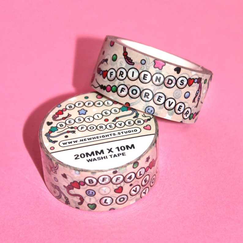 May include: Two rolls of washi tape with a light brown background and colorful designs. The tape features the words "Best Friends Forever" and "BFF4L" with hearts, stars, and smiley faces. The tape is 20mm wide and 10m long.