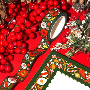 Christmas washi tape roll is displayed with a matching stationery notepad (that is sold separately.)