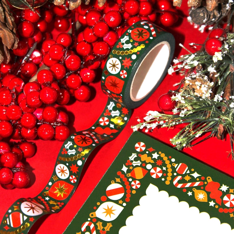 Christmas washi tape roll is displayed with a matching stationery notepad (that is sold separately.)