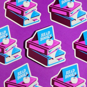 May include: Six colorful stickers with a stack of books, an apple, and the text "READ BOOKS" on a purple background. The stickers are perfect for decorating laptops, water bottles, or journals.
