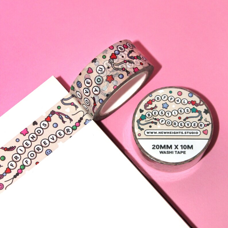 May include: Two rolls of washi tape with a light brown background and colorful designs. One roll features the words "Friends Forever" and the other roll features the words "BFFal Besties Forever". Both rolls are 20mm wide and 10m long.