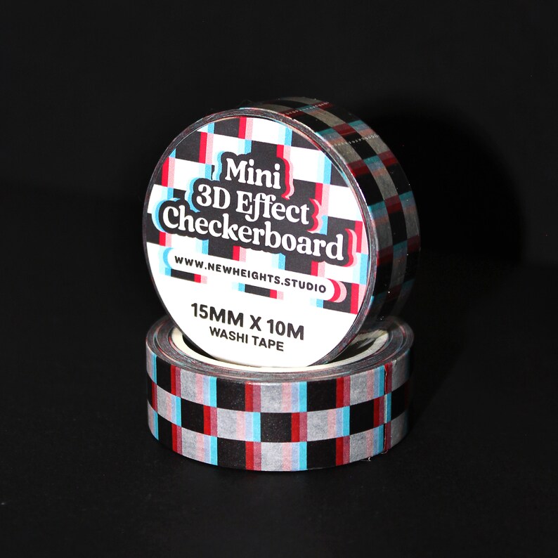 May include: A roll of black and white checkered washi tape with a 3D effect. The tape is 15mm wide and 10m long. The label on the tape reads "Mini 3D Effect Checkerboard" and "www.newheights.studio".