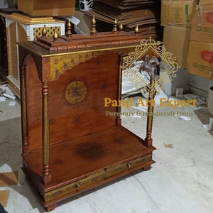 Premium Wooden Temple for Home with traditional Indian carving, decorative finials, functional storage drawer and sacred worship space for Lakshmi, Ganesha, Krishna, Radha Krishna and Bal Gopal idols. Beautiful handcrafted pooja mandir for apartments, villas and meditation rooms. #MandirForHome #WoodenTemple #PrayerRoomDecor #TempleFurniture #HandcraftedMandir #IndianHandicrafts #SacredSpace #HomeTemple #MadeInIndia #WoodCarving
