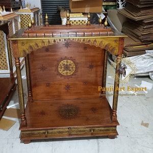 Elegant Handmade Wooden Shrine with detailed floral carving, premium brown polish, spacious pooja area and classic Indian temple design for Hindu deity idols. Perfect for home temples, apartments, meditation rooms and devotional interiors with timeless craftsmanship. #WoodenShrine #HomeTemple #PoojaMandir #TempleDecor #MandirForHome #IndianHomeDecor #WoodCarving #SacredSpace #TraditionalCraft #MadeInIndia