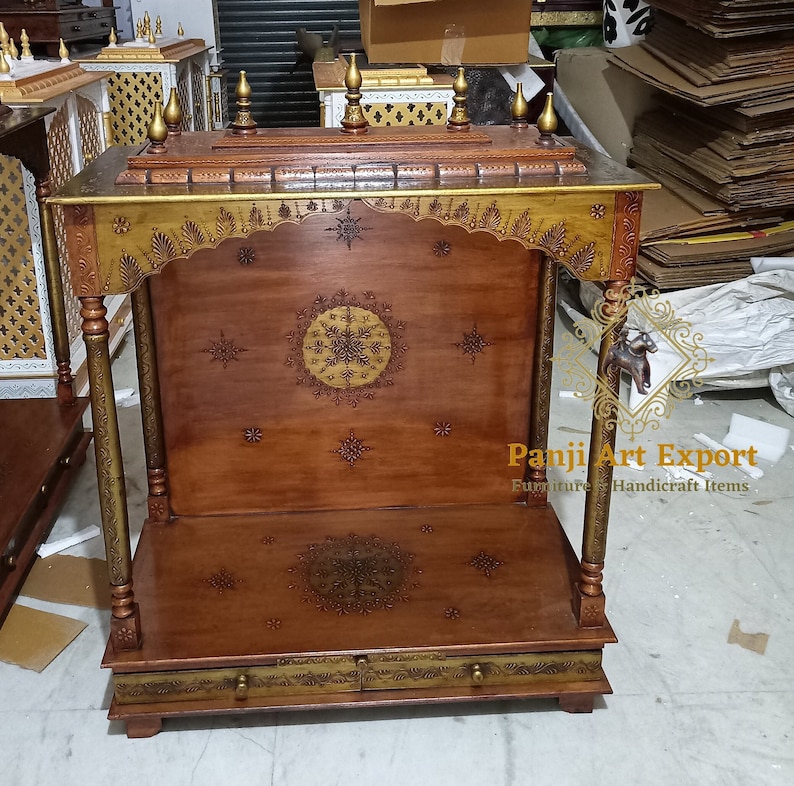 Elegant Handmade Wooden Shrine with detailed floral carving, premium brown polish, spacious pooja area and classic Indian temple design for Hindu deity idols. Perfect for home temples, apartments, meditation rooms and devotional interiors with timeless craftsmanship. #WoodenShrine #HomeTemple #PoojaMandir #TempleDecor #MandirForHome #IndianHomeDecor #WoodCarving #SacredSpace #TraditionalCraft #MadeInIndia