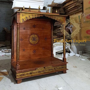 Premium Solid Wood Temple for Home featuring handcrafted Indian carving, devotional diya, elegant storage drawer and timeless traditional architecture for creating a peaceful worship space with Lakshmi, Ganesha and Krishna idols. #WoodenMandir #MandirAccessories #TempleDecor #PrayerFurniture #LuxuryHomeDecor #IndianInteriors #WoodenFurniture #HomeTemple #DecorInspiration #ArtisanMade