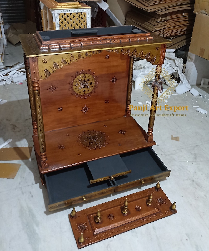 Handcrafted Wooden Prayer Temple with luxury carved design, traditional Indian architecture, decorative wooden pillars and functional storage drawer for pooja essentials. Beautiful home mandir for Lakshmi, Ganesha, Krishna and Bal Gopal idols. #PrayerRoomDecor #WoodenTemple #TempleFurniture #IndianHandicrafts #SpiritualDecor #TempleInterior #LuxuryTemple #HomeDecor #WoodCraft #EtsyFinds